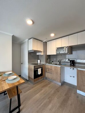 Private kitchen - Family-Friendly Apartment • Walk to Parks & Shops • Safe and comfort for all. (Santiago)