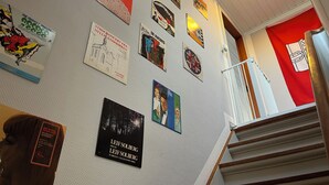 A wall with various posters and a book. - Struer Family House | 600m to Beach, Garden with Trampoline & Play Area (Struer)