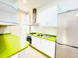 Apartment, Balcony, City View | Private kitchen | Fridge, microwave, oven, stovetop