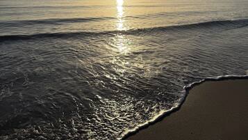 On the beach, white sand, beach volleyball, beach bar