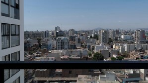 A cityscape with a mix of high-rise and low-rise buildings. - w* | Amazing 1BR w/ Balcony in Barranco (Barranco)