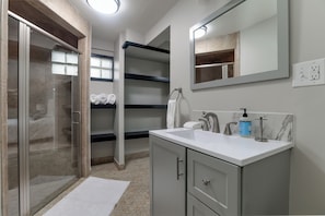 Shower, hair dryer, towels, soap - Modern East Side Ranch (Wichita)
