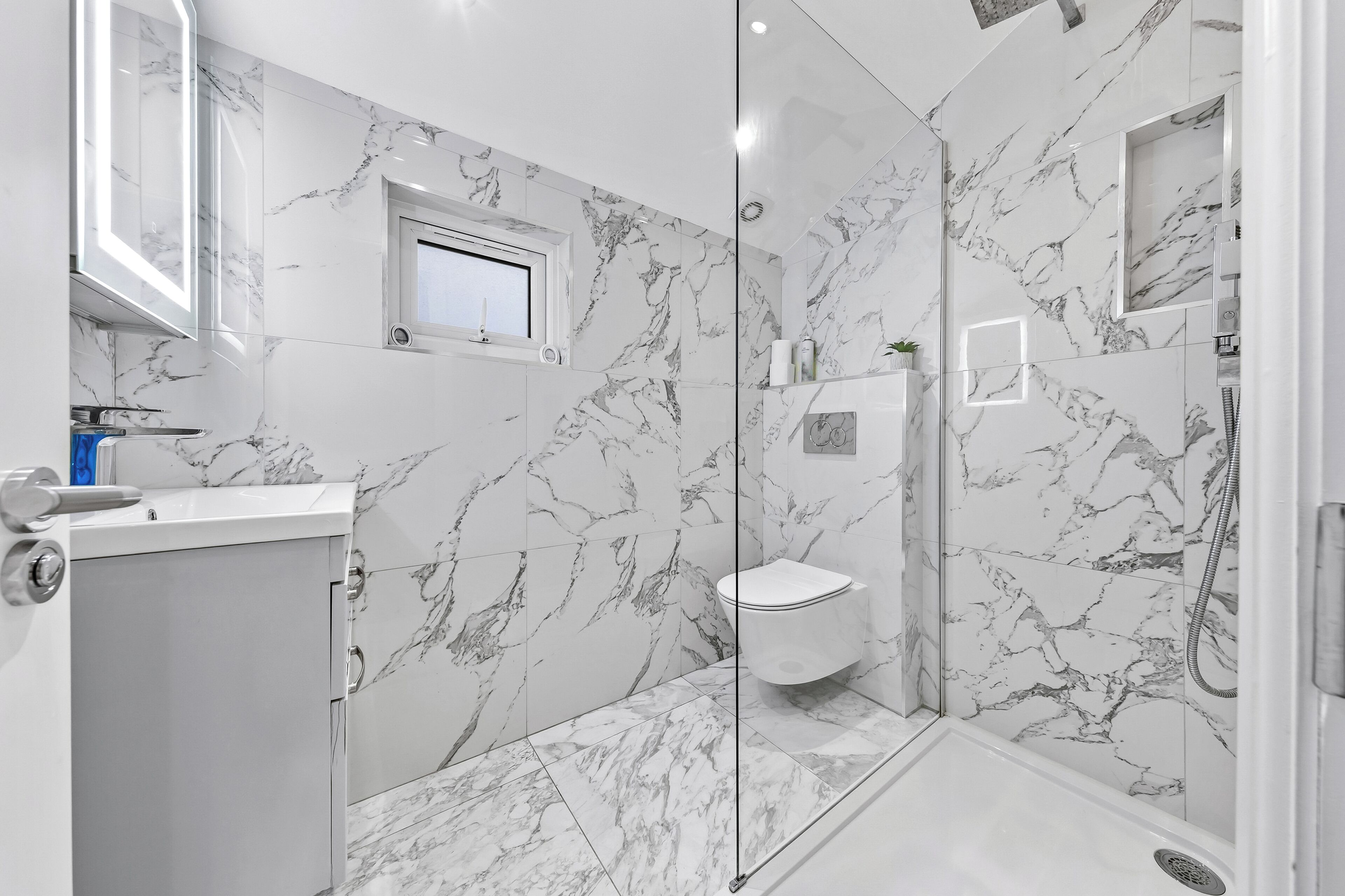 Shower, hair dryer, towels, toilet paper