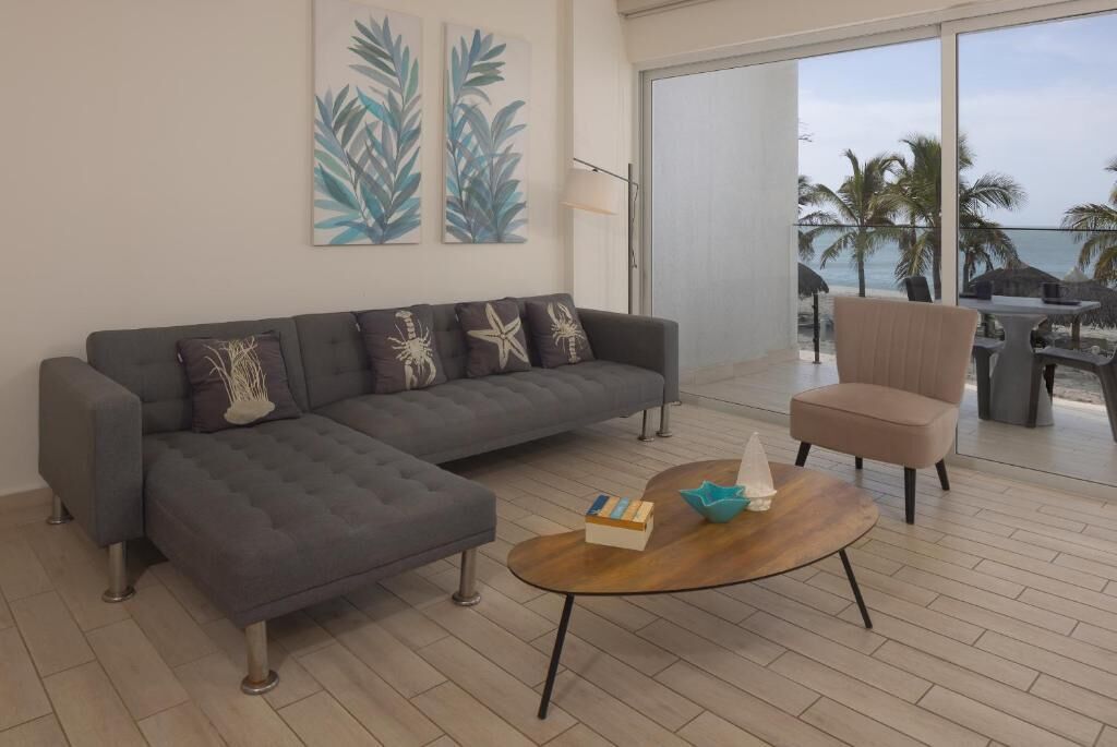 Apartment, Balcony, Sea View | Living area | 50-inch Smart TV with cable channels