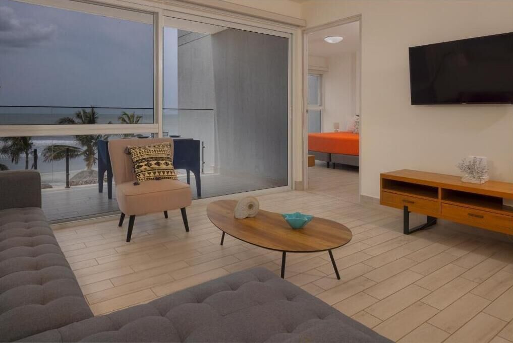 Apartment, Balcony, Sea View | Living area | 50-inch Smart TV with cable channels