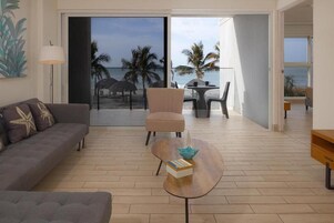Apartment, Balcony, Sea View | Living area | 50-inch Smart TV with cable channels