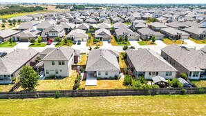 A residential area with multiple houses, each with a sloped roof and a front yard. - Shepherd’s Path | Pet-Friendly 3BR/2BA Monthly Rental in New Braunfels (New Braunfels)