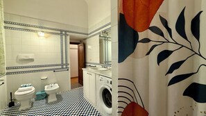 A bathroom with a checkered floor, a sink, a toilet, a bidet, and a washing machine. - Zanobi 75 - Three Bedroom Apartment, Sleeps 7 (Firenze)