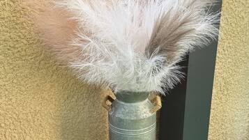 A metal container with a label 'Garden Edition Vintage Since 1932' and a white fluffy material inside.