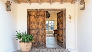 A rustic wooden door leading to a room with a view of the sea. - Laeticia - Seven Bedroom Villa, Sleeps 14 (Finikas)