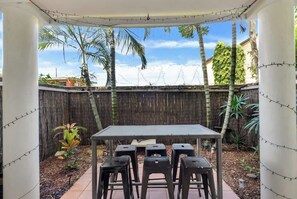 Outdoor dining - The Palms Poolside Escape near the Esplanade   CBD (Cairns North)