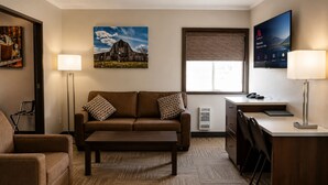 Superior Suite, 1 King Bed with Sofa bed, Housekeeping, City View | Living area | 55-inch Smart TV with cable channels