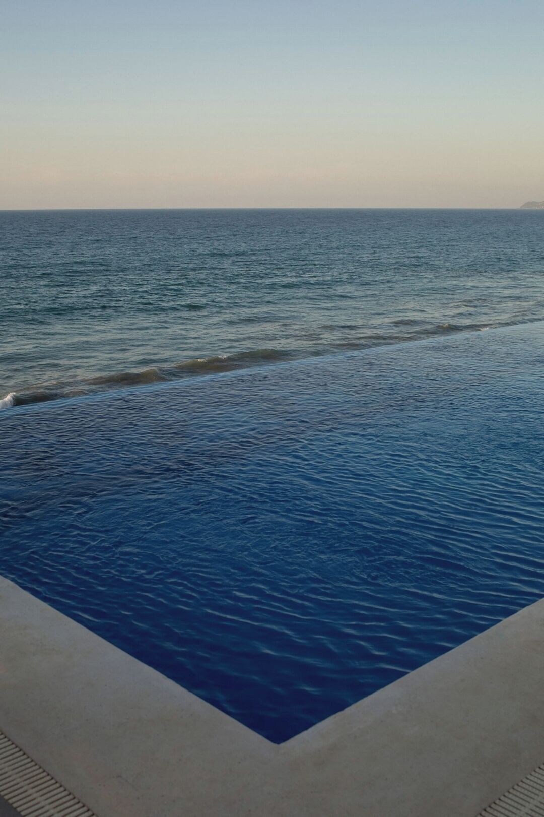 A pool with a view of the ocean.