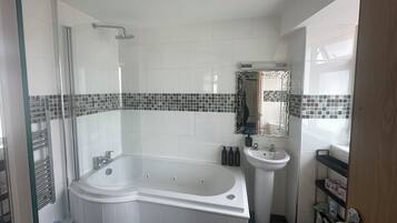 Jetted bath, hair dryer, towels, soap