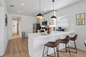 Fridge, microwave, oven, stovetop - Minutes to Downtown: Spacious 4BR/3BA Historic Gem (San Antonio)