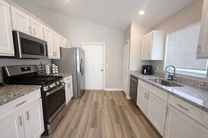 Fridge, microwave, oven, stovetop - Enchanted Escape 3BR Near Disney with Private Pool (Davenport)