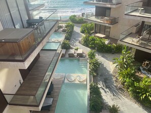 Outdoor pool, a heated pool - Beachfront apartment with private jacuzzi (Sin.)