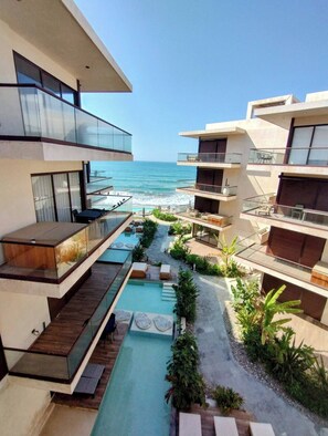 Outdoor pool, a heated pool - Beachfront apartment with private jacuzzi (Sin.)