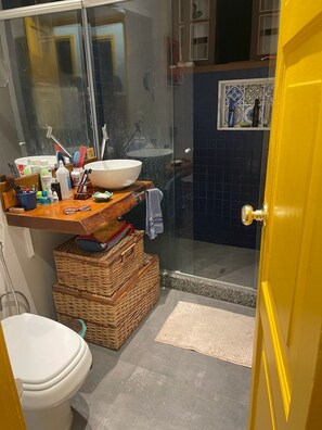 Shower, hair dryer, towels, toilet paper