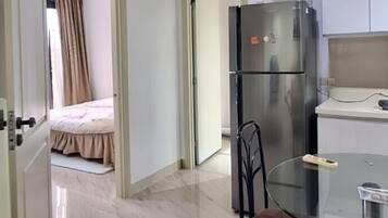 Apartamento luxo, vista para o jardim, no jardim | Área de estar | Smart TV 45 polegadas com canais digitais, Netflix