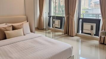 Deluxe Apartment, Garden View, Garden Area | Minibar, in-room safe, iron/ironing board, free WiFi