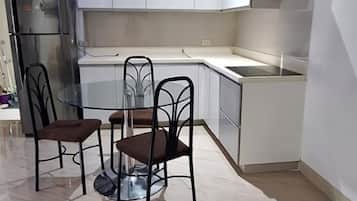 Deluxe Apartment, Garden View, Garden Area | Private kitchen | Espresso maker, coffee/tea maker, electric kettle