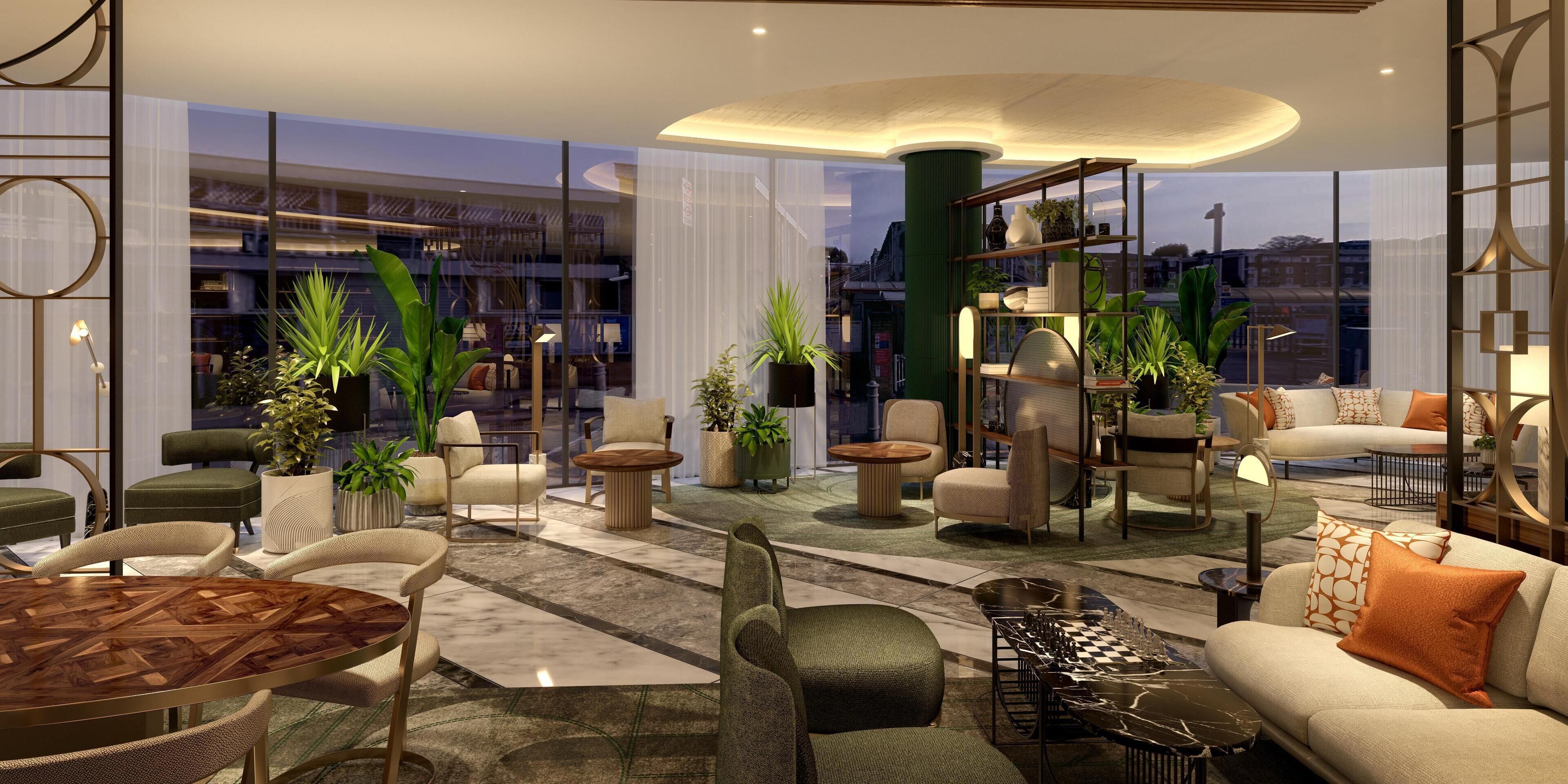 A modern interior with a mix of seating areas, a chess table, and a view of the city through large windows.