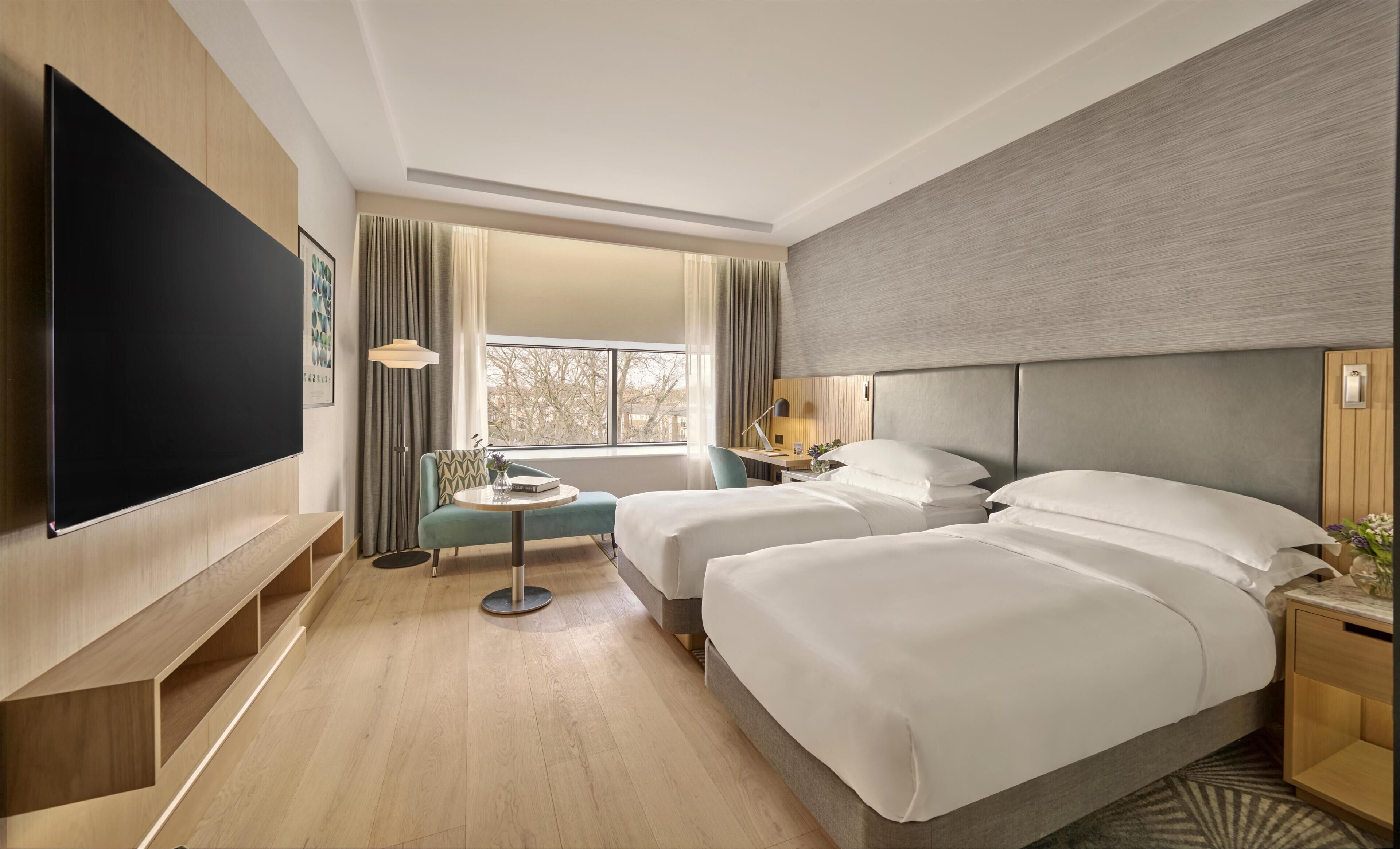 Deluxe kamer, 2 eenpersoonsbedden | Hypoallergeen beddengoed, een kluis op de kamer