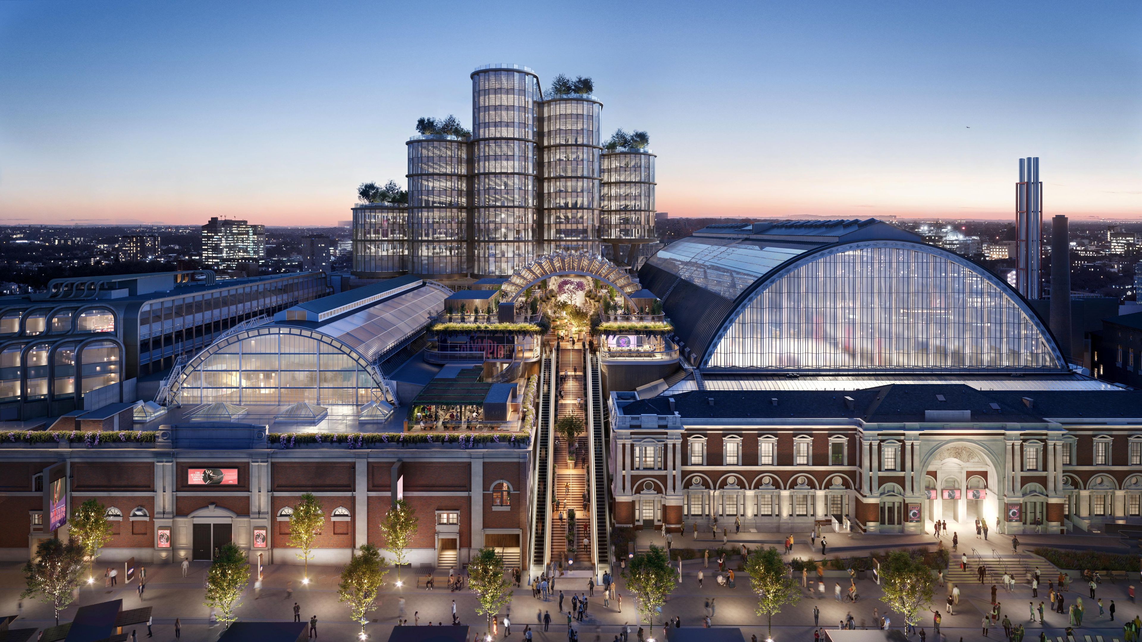 A modern architectural complex with a central atrium, multiple levels, and a mix of glass and brick structures.