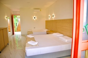 Deluxe Triple Room, Balcony, Mountain View | Desk, laptop workspace, free WiFi