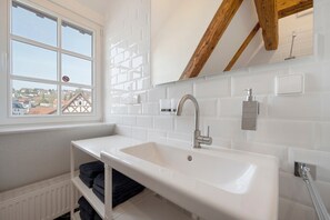 Shower, hair dryer, towels