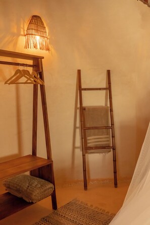 A room with a wooden bed frame, a hanging light fixture, a wooden ladder, and a woven rug. - Aldea Paakat, Private Luxury Villa in the Mayan Jungle (buenavista)