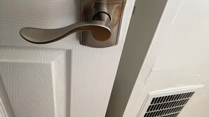 A door with a keypad lock and a lever handle. - GE, NEAR ZOO , Fairmount Park, Spacious 9 bedrooms 3 bathrooms entire house (Philadelphia)