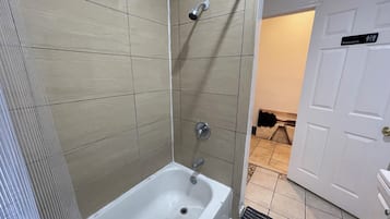 Shower, towels, soap, toilet paper