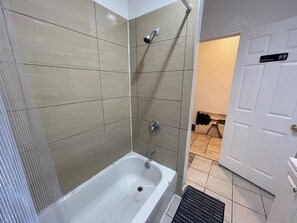 Shower, towels, soap, toilet paper