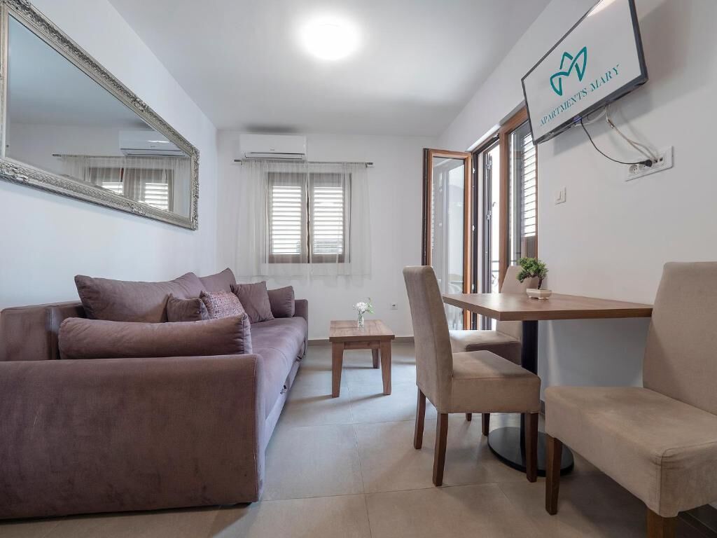 Superior Apartment, Balcony | Living area | 32-inch LCD TV with cable channels