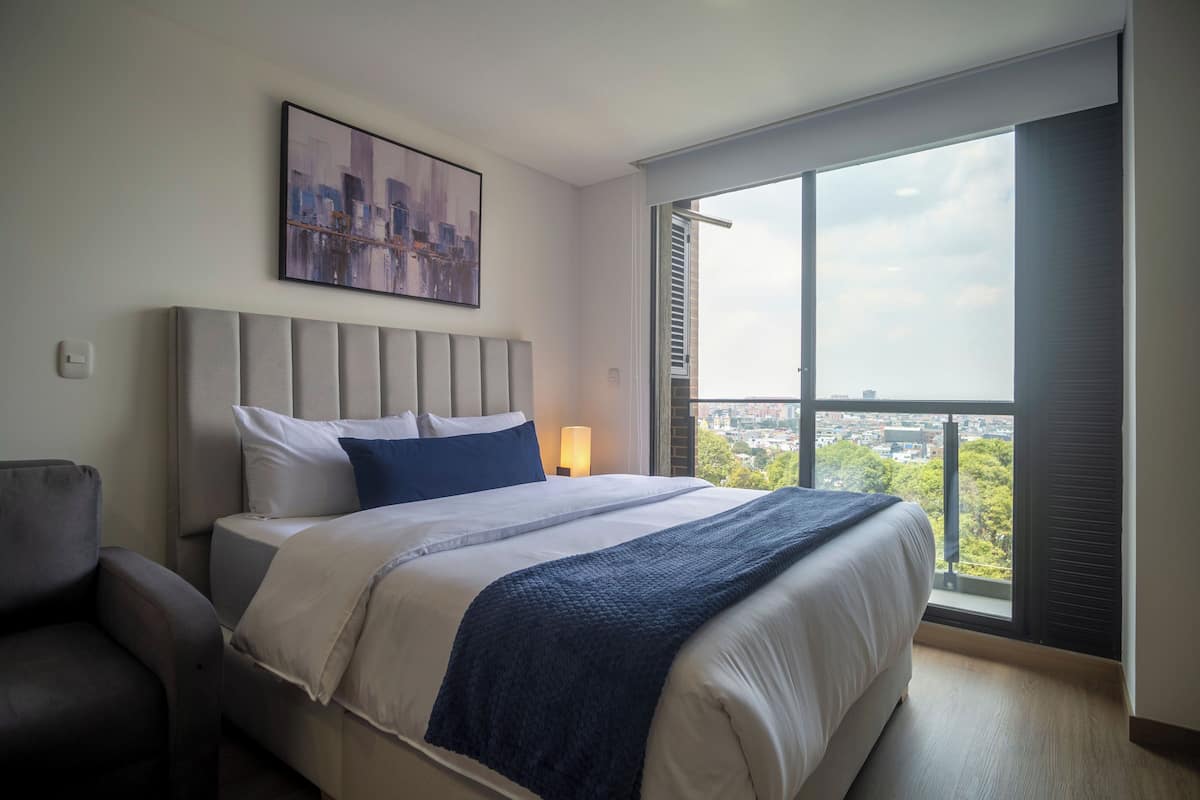 Comfort Studio Suite, Balcony, Park View | In-room safe, desk, laptop workspace, iron/ironing board