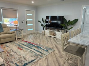 TV, fireplace - Island Vibes Retreat - 3 BR/2 BA Tropical Pool Home 3 minutes from the Beach! (St. Pete Beach)