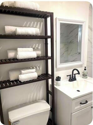 Hair dryer, towels, soap, shampoo