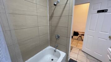 Shower, towels, soap, toilet paper