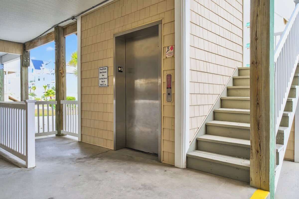An elevator in a building with a sign indicating it is for the 1st floor.