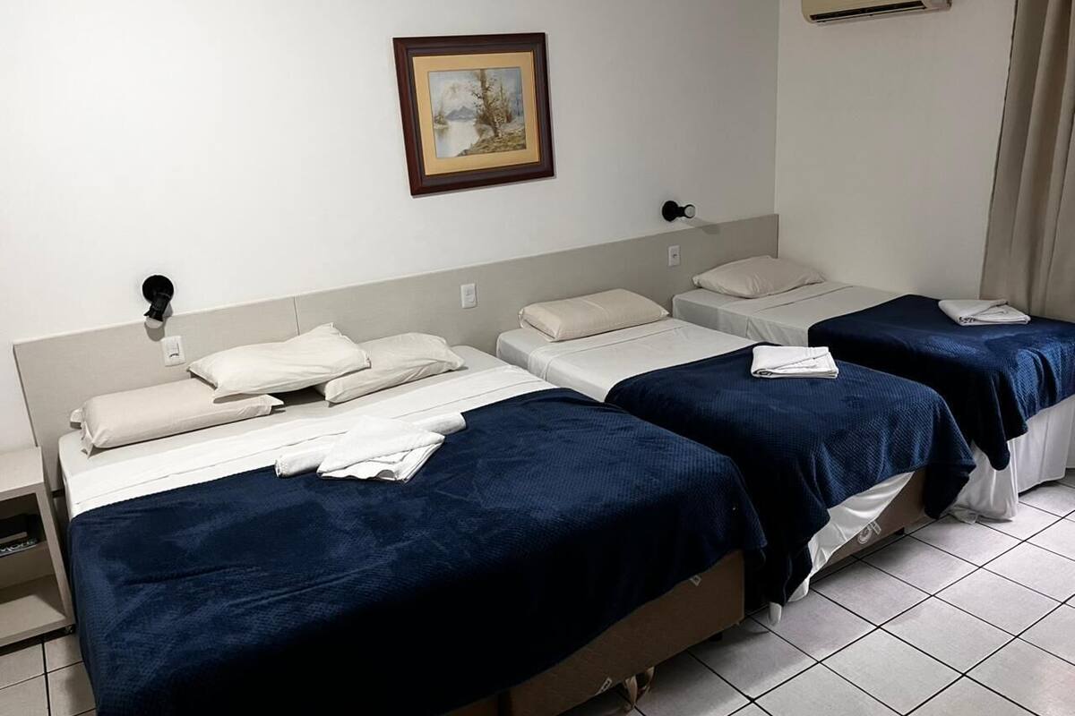 Classic Quadruple Room | In-room safe, desk, laptop workspace, blackout curtains