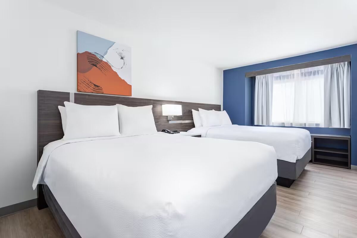 Unwind in bright, airy comfort with two plush beds.