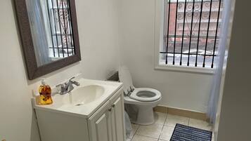 Shower, towels, soap, toilet paper