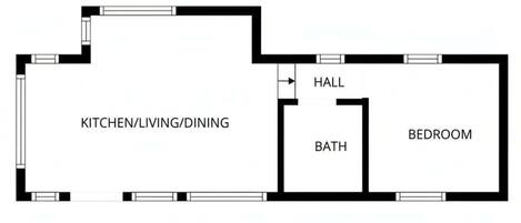 En planritning som visar ett kök, vardagsrum/matsal, hall, badrum och sovrum.