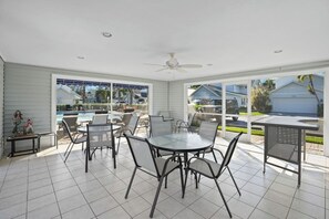 Outdoor dining - 3BR Getaway • Pool Access • Screened Lanai (Naples)