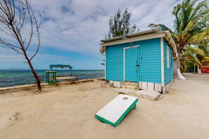 Exterior - Rustic overwater cabin with oceanfront deck, island kitchen & sea breeze views (Placencia)