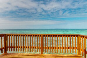 Property grounds - Rustic overwater cabin with oceanfront deck, island kitchen & sea breeze views (Placencia)