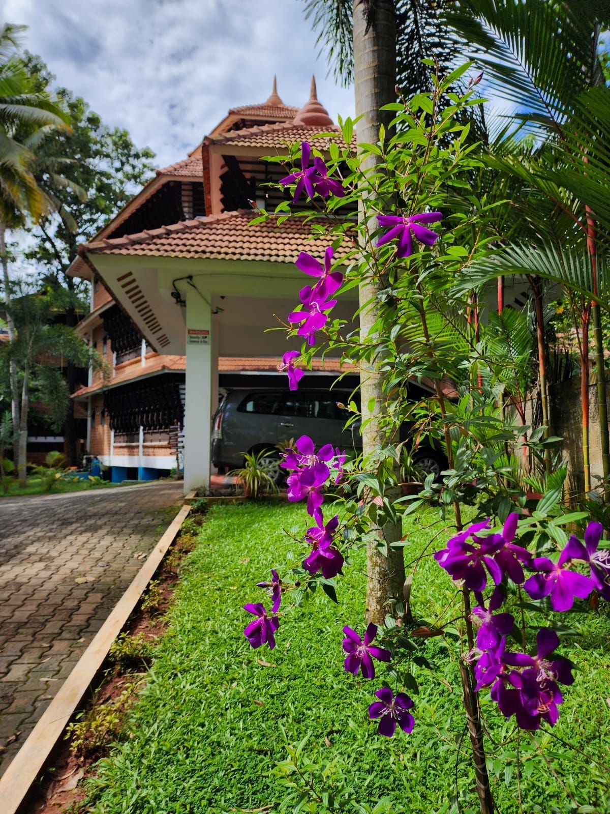 A traditional building with a tiled roof and a covered porch.