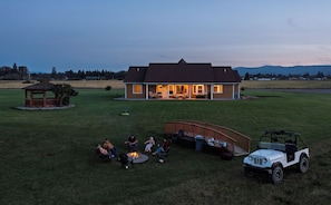 A house with a covered patio area and a small gazebo.